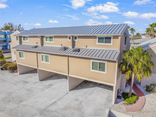 back of property with central air condition unit