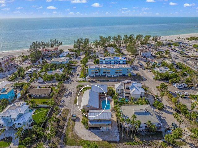 aerial view featuring a view of the beach and a water view