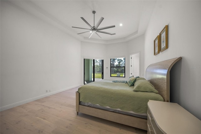 bedroom with light hardwood / wood-style flooring and ceiling fan