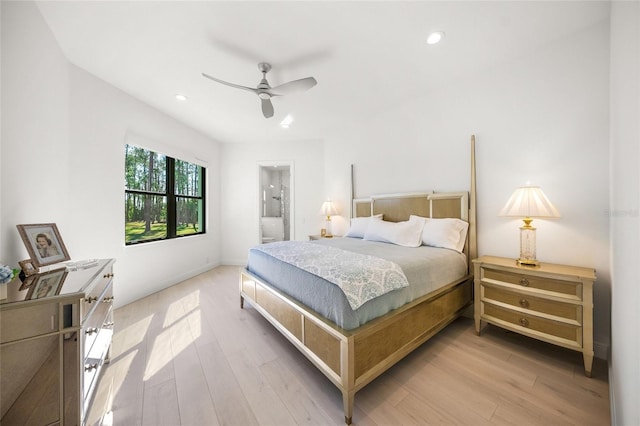 bedroom with light hardwood / wood-style floors, ceiling fan, and ensuite bathroom