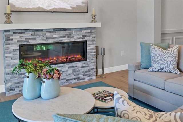 8089 Sandstar Way, Sarasota, FL 34240 - living area featuring wood finished floors and a fireplace