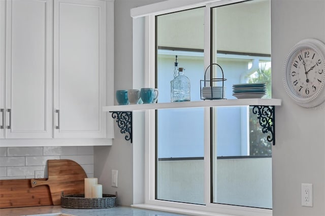 details with tasteful backsplash and white cabinetry