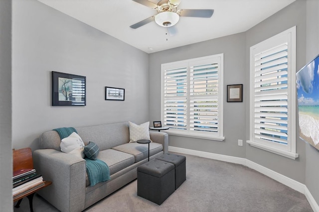 sitting room with carpet flooring and ceiling fan