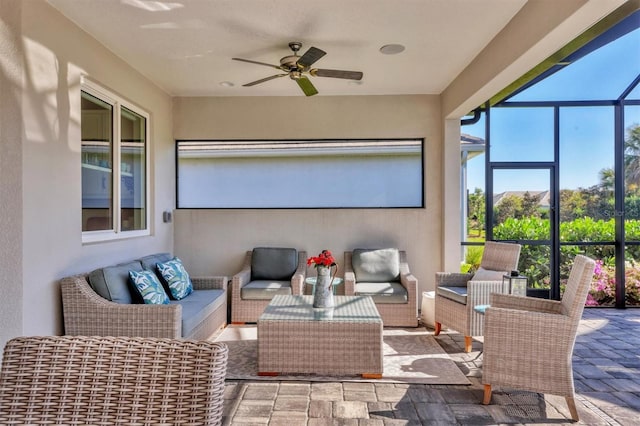 sunroom with ceiling fan