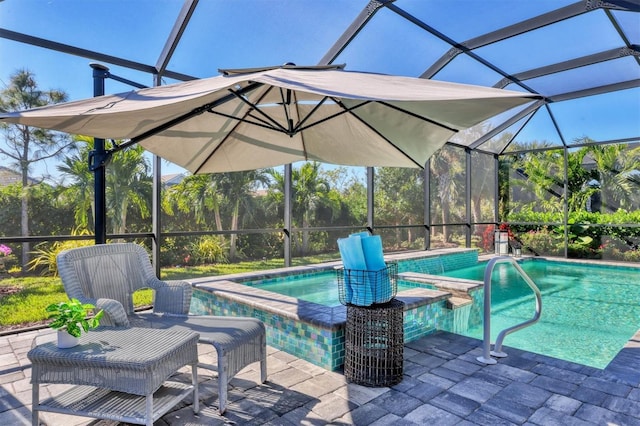 view of swimming pool with a hot tub, a lanai, and a patio area