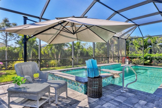 8089 Sandstar Way, Sarasota, FL 34240 - view of swimming pool with glass enclosure, a pool with connected hot tub, and a patio area