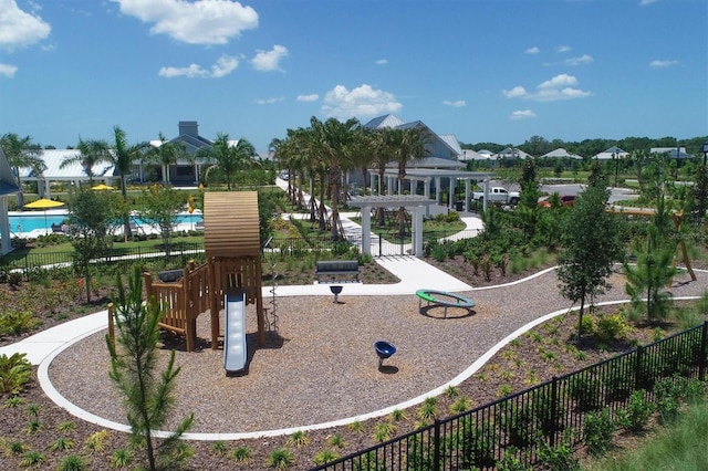 view of property's community with a pergola and a playground