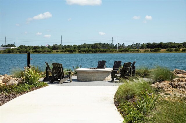 8089 Sandstar Way, Sarasota, FL 34240 - surrounding community featuring a fire pit and a water view