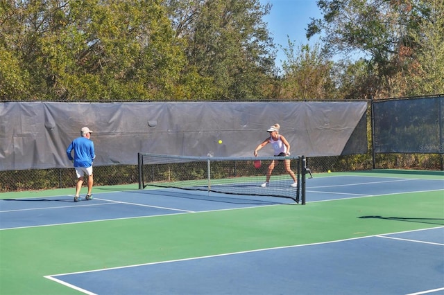 8089 Sandstar Way, Sarasota, FL 34240 - view of tennis court featuring community basketball court
