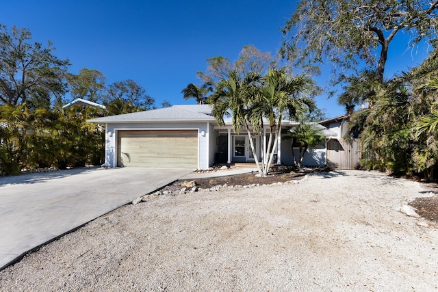 ranch-style home featuring a garage