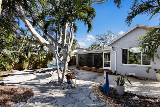 exterior space featuring a sunroom and a patio area