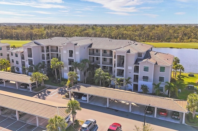 birds eye view of property with a water view