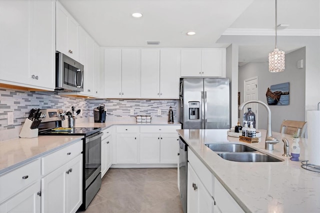 kitchen with pendant lighting, white cabinetry, sink, and stainless steel appliances