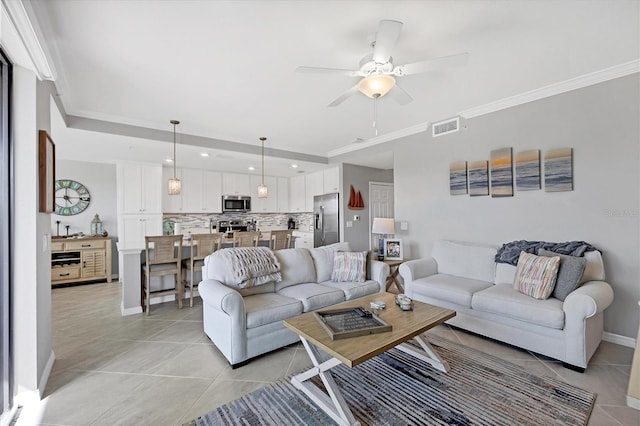 living room featuring ceiling fan, ornamental molding, and light tile patterned flooring