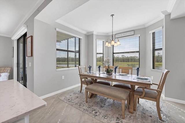 tiled dining room with ornamental molding and a chandelier