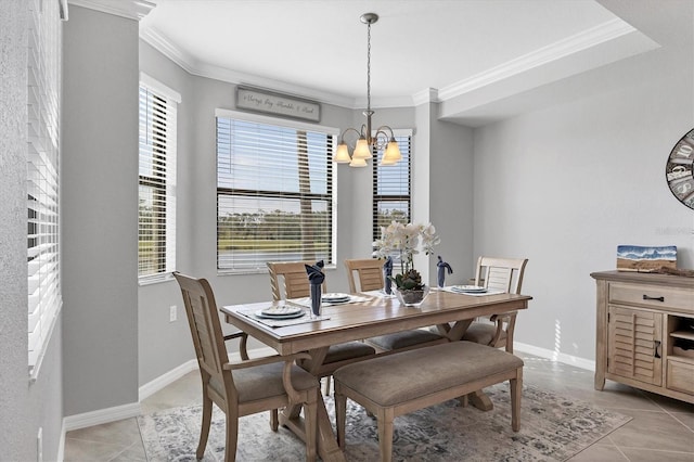 tiled dining room featuring crown molding and a chandelier