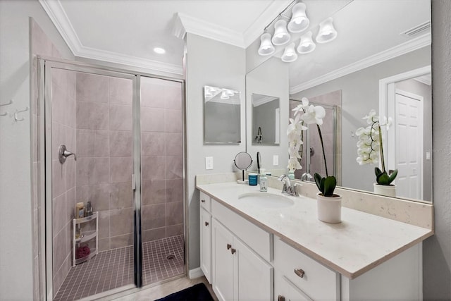 bathroom featuring vanity, ornamental molding, and walk in shower