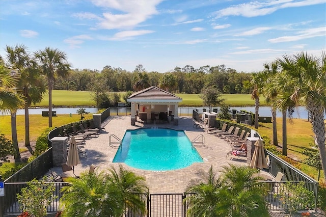 view of swimming pool featuring a gazebo, a water view, and a patio