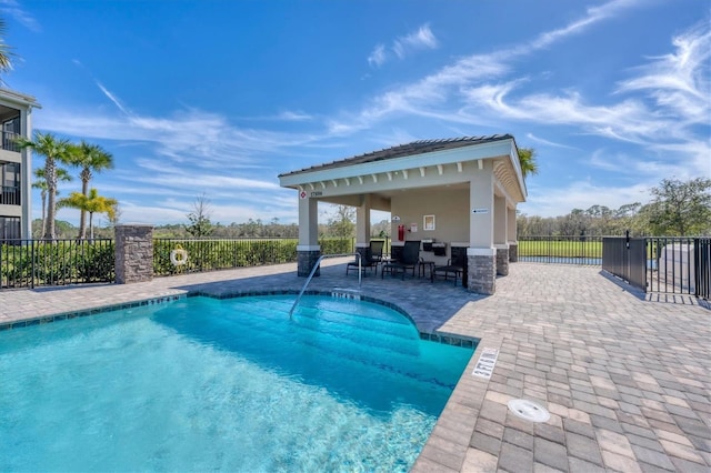 view of swimming pool with a gazebo and a patio