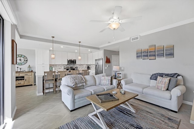 living room with light tile patterned flooring, baseboards, ceiling fan, ornamental molding, and recessed lighting