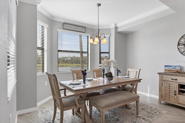 dining area with a chandelier, ornamental molding, healthy amount of natural light, and light tile patterned flooring