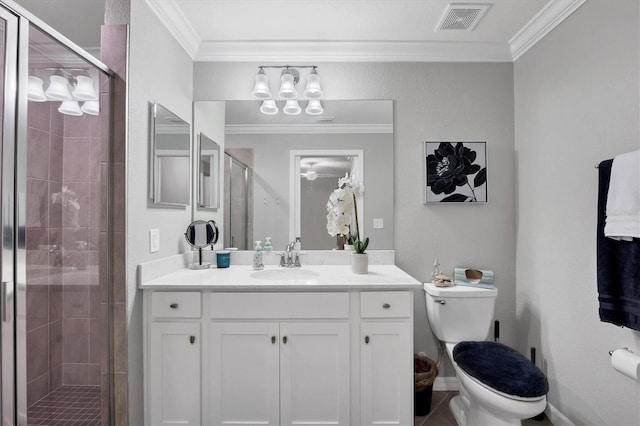 bathroom with crown molding, a stall shower, toilet, vanity, and ceiling fan