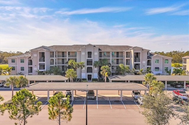 view of property featuring covered parking