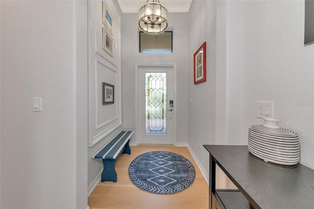 foyer entrance featuring a chandelier