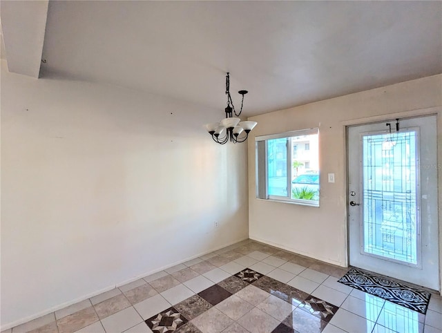 interior space with light tile patterned floors and a notable chandelier