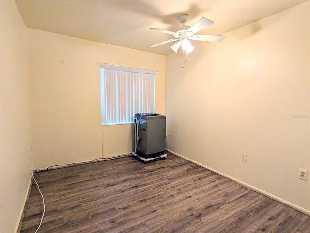 empty room featuring dark hardwood / wood-style flooring and ceiling fan