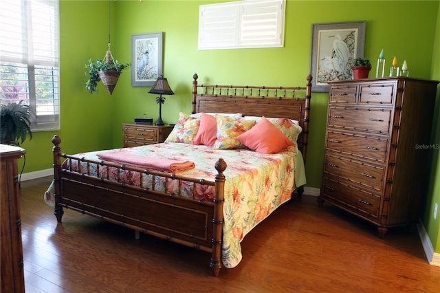 bedroom featuring dark wood-type flooring