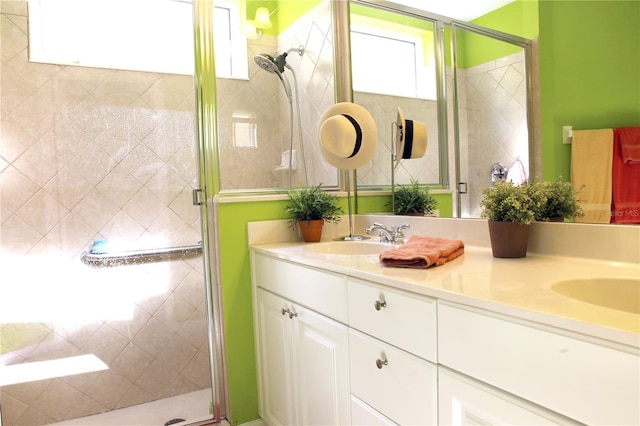 bathroom with vanity and an enclosed shower