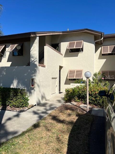 5171 Willow Links Unit 23, Sarasota, FL 34235 - view of front facade featuring stucco siding
