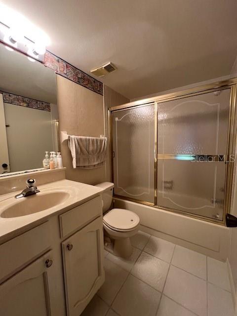 5171 Willow Links Unit 23, Sarasota, FL 34235 - full bath featuring vanity, tile patterned flooring, and shower / bath combination with glass door