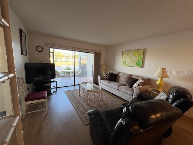 5171 Willow Links Unit 23, Sarasota, FL 34235 - living room with wood finished floors