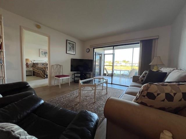 5171 Willow Links Unit 23, Sarasota, FL 34235 - living room featuring wood finished floors