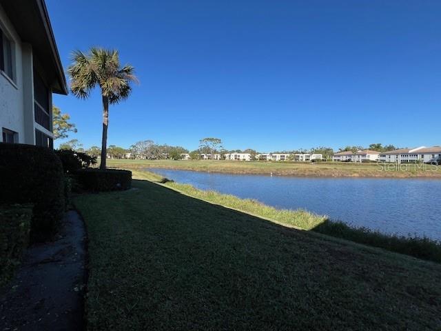 5171 Willow Links Unit 23, Sarasota, FL 34235 - view of grassy yard featuring a water view