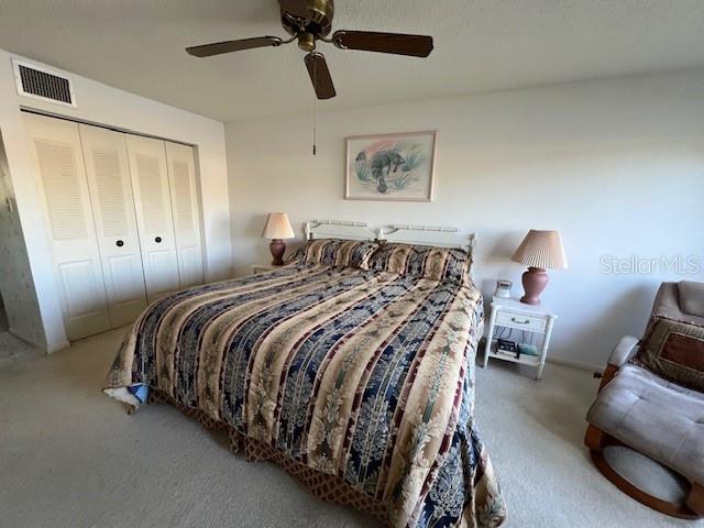 5171 Willow Links Unit 23, Sarasota, FL 34235 - carpeted bedroom with a closet and ceiling fan