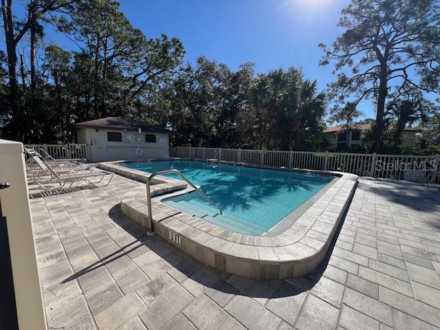 5171 Willow Links Unit 23, Sarasota, FL 34235 - community pool featuring a patio