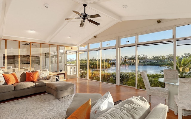 sunroom with a water view, ceiling fan, and lofted ceiling with beams