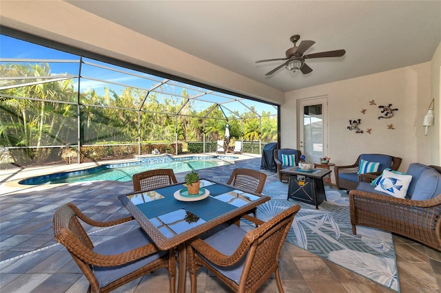 view of patio / terrace with outdoor lounge area, ceiling fan, and a lanai