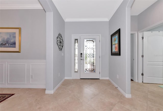 tiled foyer with crown molding