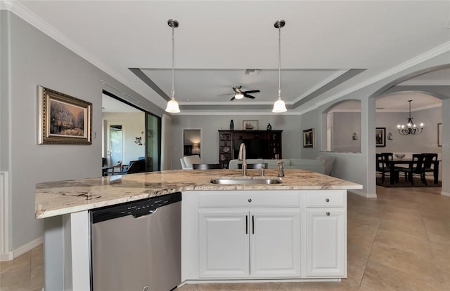 kitchen featuring pendant lighting, dishwasher, ceiling fan with notable chandelier, sink, and white cabinetry