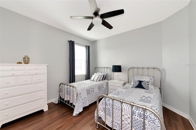 bedroom with ceiling fan and dark wood-type flooring