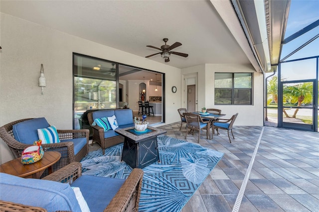 view of patio with an outdoor living space and ceiling fan