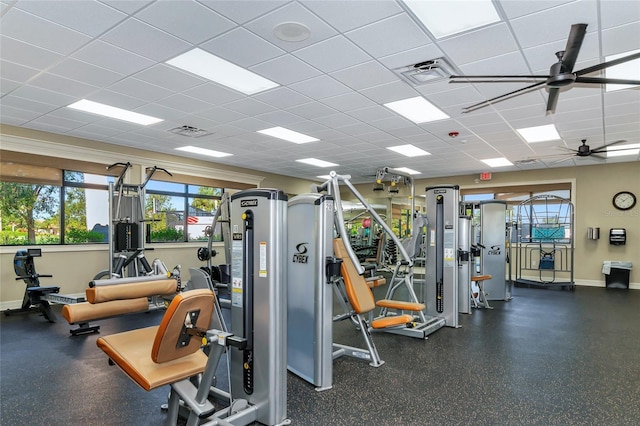 workout area featuring a paneled ceiling and ceiling fan