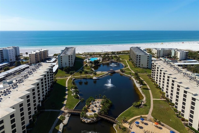 bird's eye view with a beach view and a water view