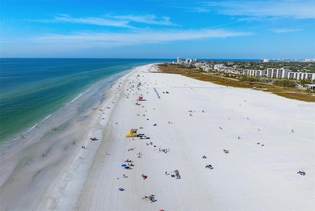 aerial view with a water view and a beach view