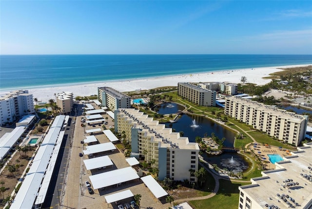 aerial view with a water view and a view of the beach