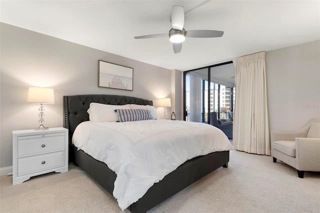 carpeted bedroom with access to outside and ceiling fan